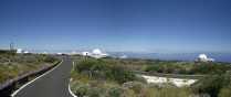 Tenerife, Canary Islands, international astrophysical installations at 8000 feet, lots of white domes, blue sky and the volcano (not in view) plainly visible, great place to work.